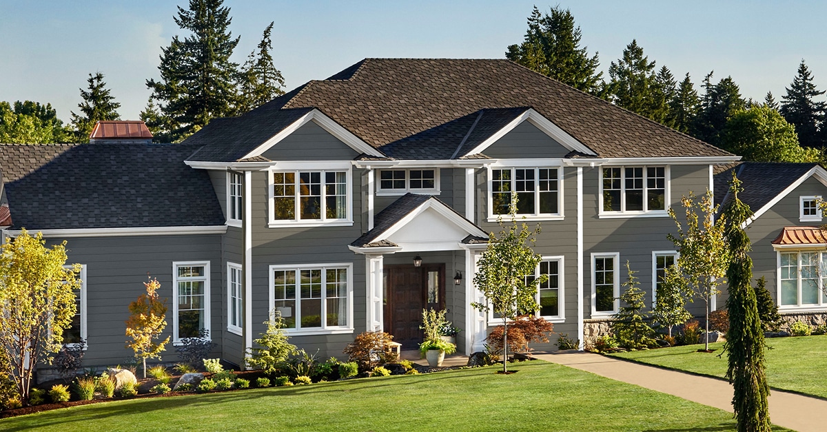 dark grey siding and white window trim